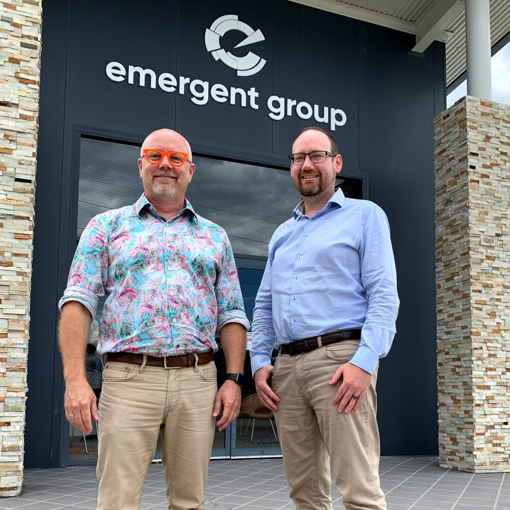 Chris Kellett and Paul Reynolds in front of entrance to Emergent Group HQ