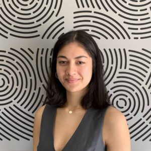 Headshot of Luka in front of patterned background 