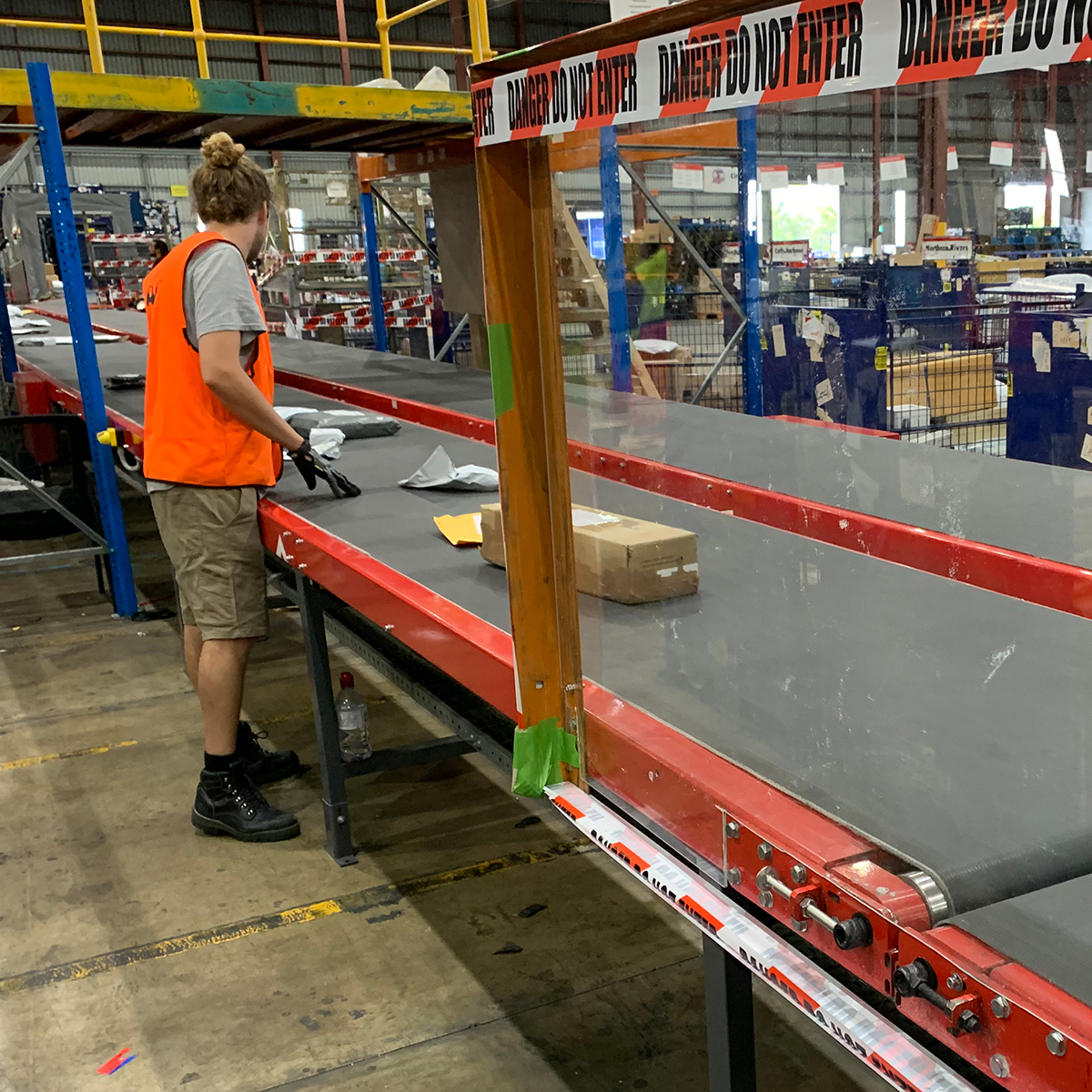 Man at conveyer belt